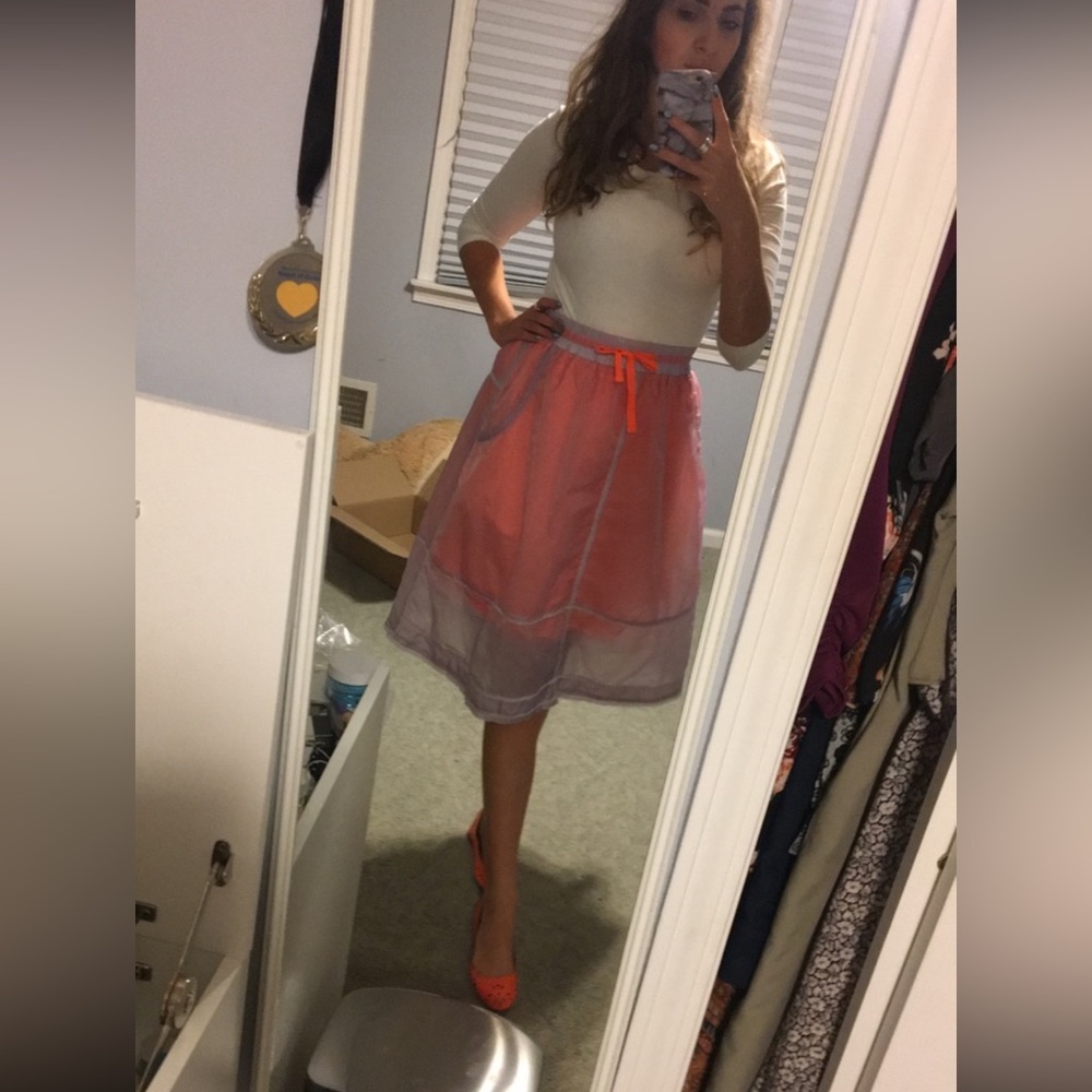 Orange skirt with sheer purple overlay